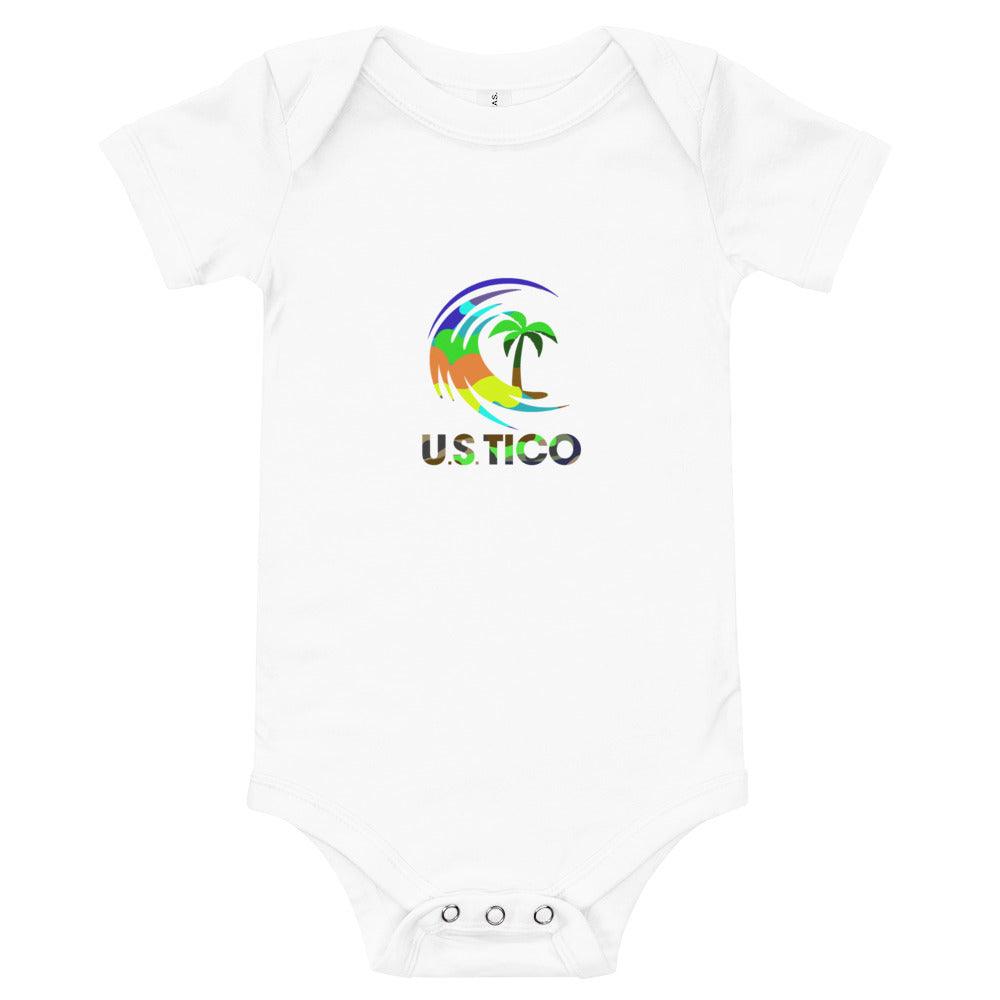 White baby bodysuit with a colorful U.S.TICO tropical palm tree and wave logo