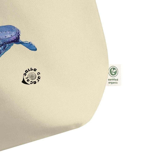 SC Natural Whale organic cotton tote bag in natural cream, featuring a blue whale graphic and certified organic tag