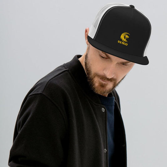 Man wearing a black and white trucker hat with a yellow palm tree logo.