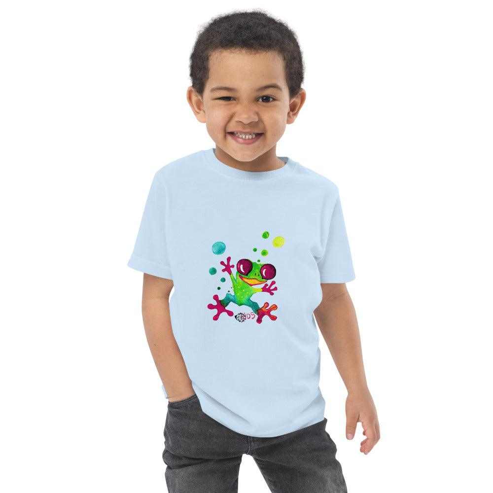 Kids Jungle Frog T-Shirt in pale blue cotton with a colorful cartoon frog and playful tropical accents printed on the front