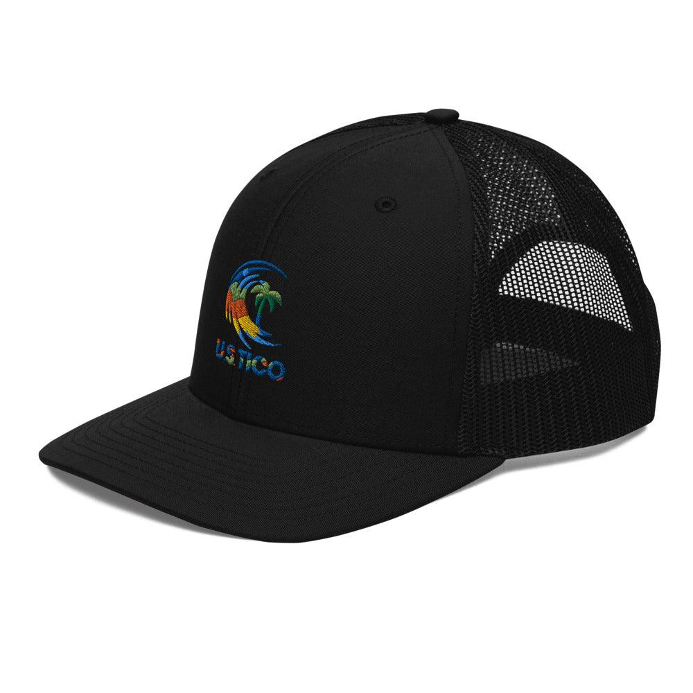 US Tico Colorful Trucker Cap in black with a small multicolored tropical logo, curved brim and mesh back