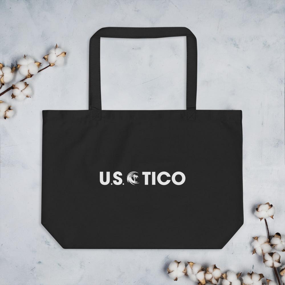 US Tico Large Organic Cotton Tote Bag in black cotton with wide straps, a flat base, and white U.S. TICO logo